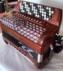 Chromatic button accordion of 47 notes (87 buttons) and 120 bass with tone chamber (cassotto) 